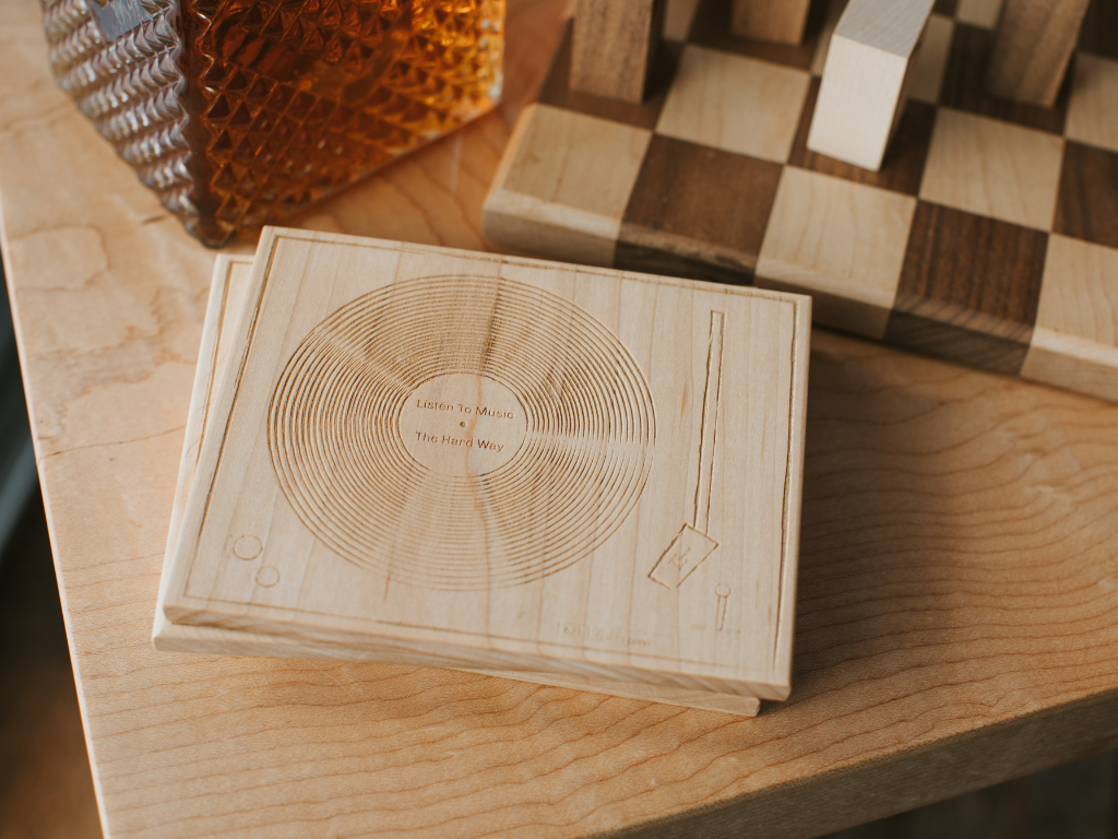 Deep Cut Turntable Coasters - wooden coasters with the image of a vintage turntable etched in them.